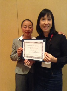 SEAA Li Zhang and Prize Committee Chair Jenny Chio present the Plath Media Prize. Image courtesy SEAA