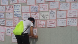 A supporter posting his words of support at a CUHK wall. Photo courtesy Annemarelle van Schayik