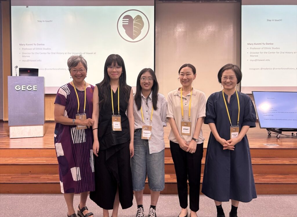 line of 5 East Asia anthropologists in front of a conference stage